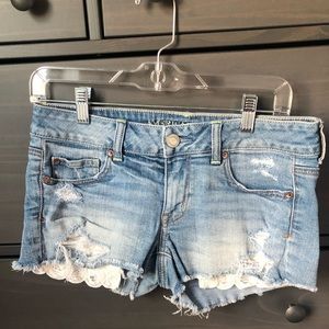 Light wash mid rise AE shorts